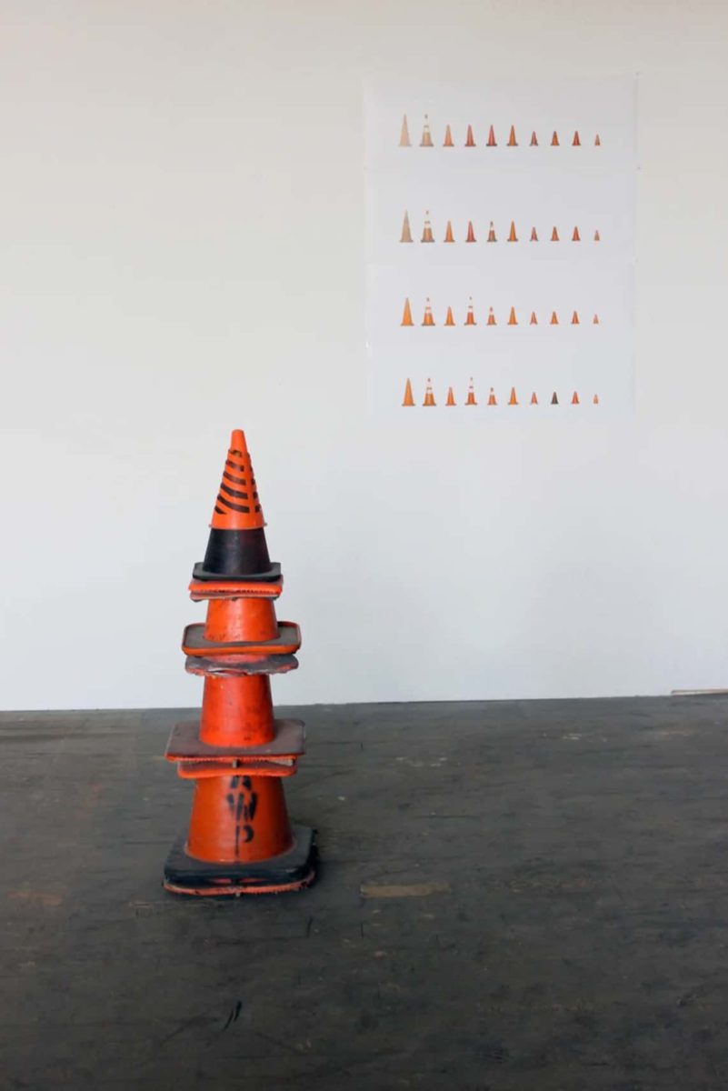 A stack of traffic cones in a museum