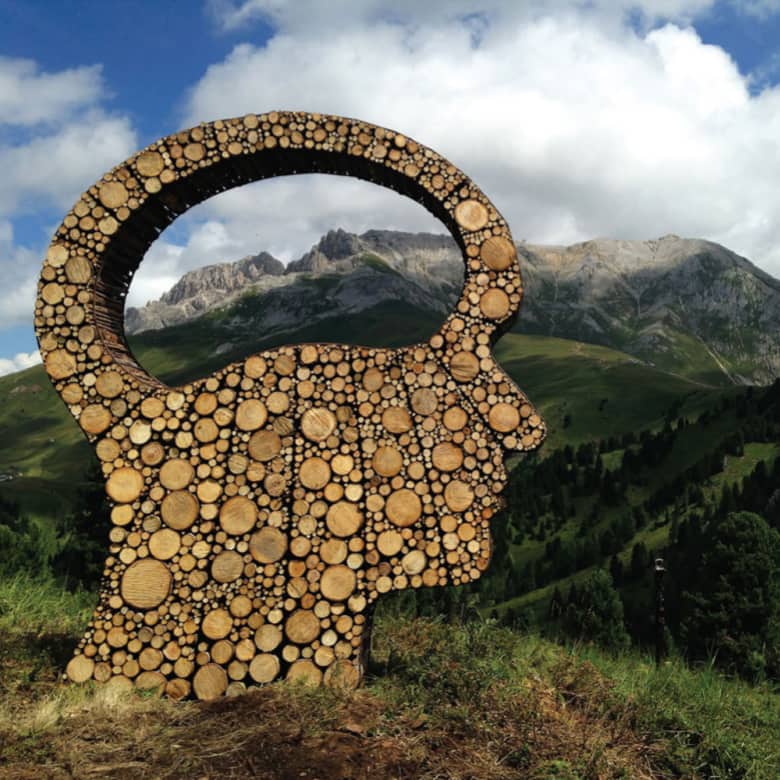 A sculpture of a face made out of wood